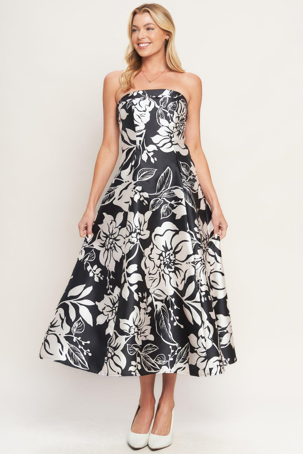 A printed woven midi dress featuring straight neckline, circle skirt and back zipper closure