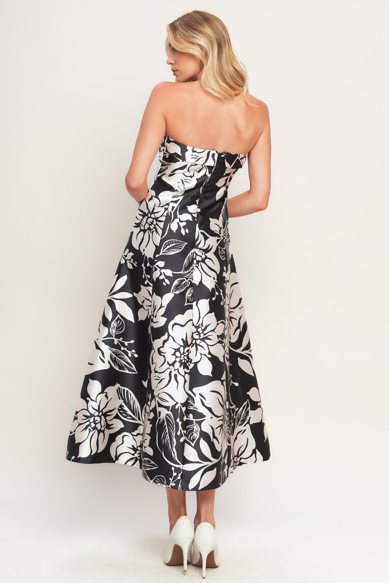A printed woven midi dress featuring straight neckline, circle skirt and back zipper closure