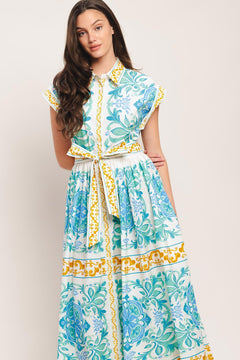 A printed woven midi dress featuring collar, short sleeve, front button down, self sash tie and full skirt

Details:

Self: 100% Cotton

Size & Fit

-Model is 5`8" And Wearing Size Small
-Measurements Taken From Size Small
-Approx. Length: 51"