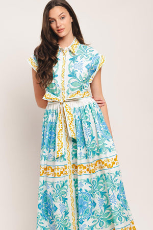 A printed woven midi dress featuring collar, short sleeve, front button down, self sash tie and full skirt

Details:

Self: 100% Cotton

Size & Fit

-Model is 5`8" And Wearing Size Small
-Measurements Taken From Size Small
-Approx. Length: 51"