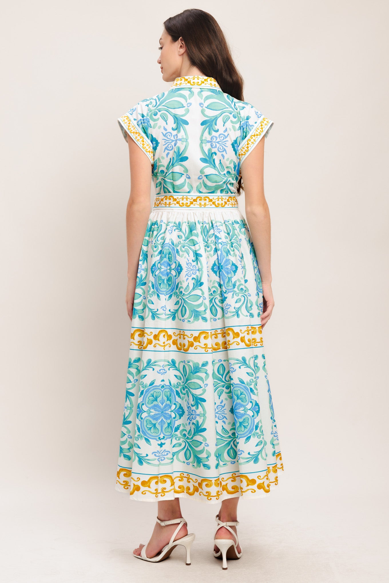 A printed woven midi dress featuring collar, short sleeve, front button down, self sash tie and full skirt

Details:

Self: 100% Cotton

Size & Fit

-Model is 5`8" And Wearing Size Small
-Measurements Taken From Size Small
-Approx. Length: 51"