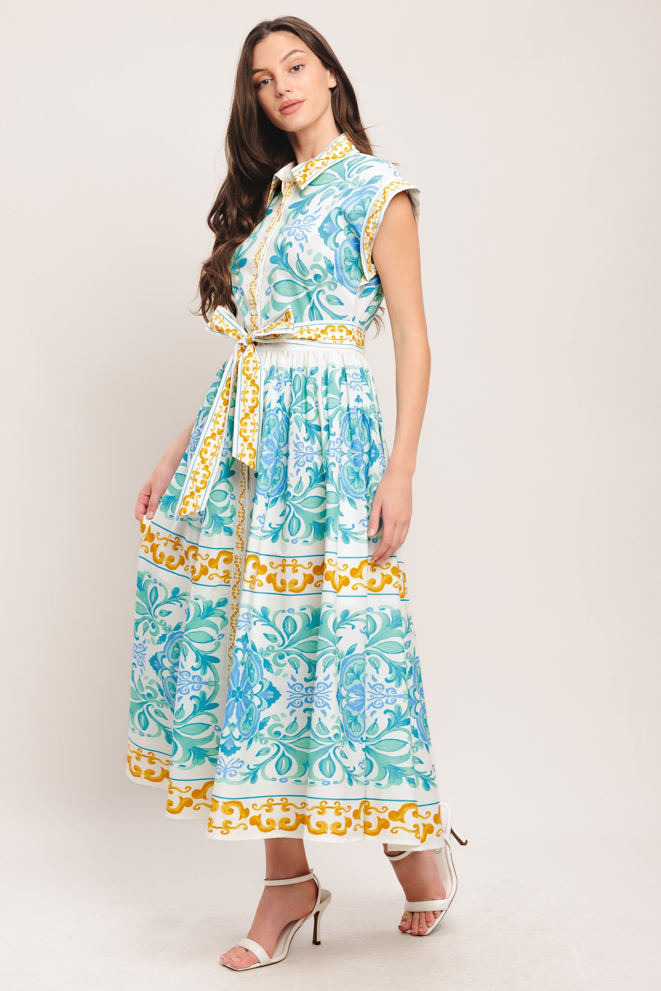 A printed woven midi dress featuring collar, short sleeve, front button down, self sash tie and full skirt

Details:

Self: 100% Cotton

Size & Fit

-Model is 5`8" And Wearing Size Small
-Measurements Taken From Size Small
-Approx. Length: 51"