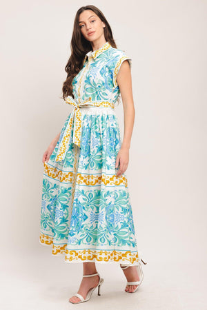 A printed woven midi dress featuring collar, short sleeve, front button down, self sash tie and full skirt

Details:

Self: 100% Cotton

Size & Fit

-Model is 5`8" And Wearing Size Small
-Measurements Taken From Size Small
-Approx. Length: 51"