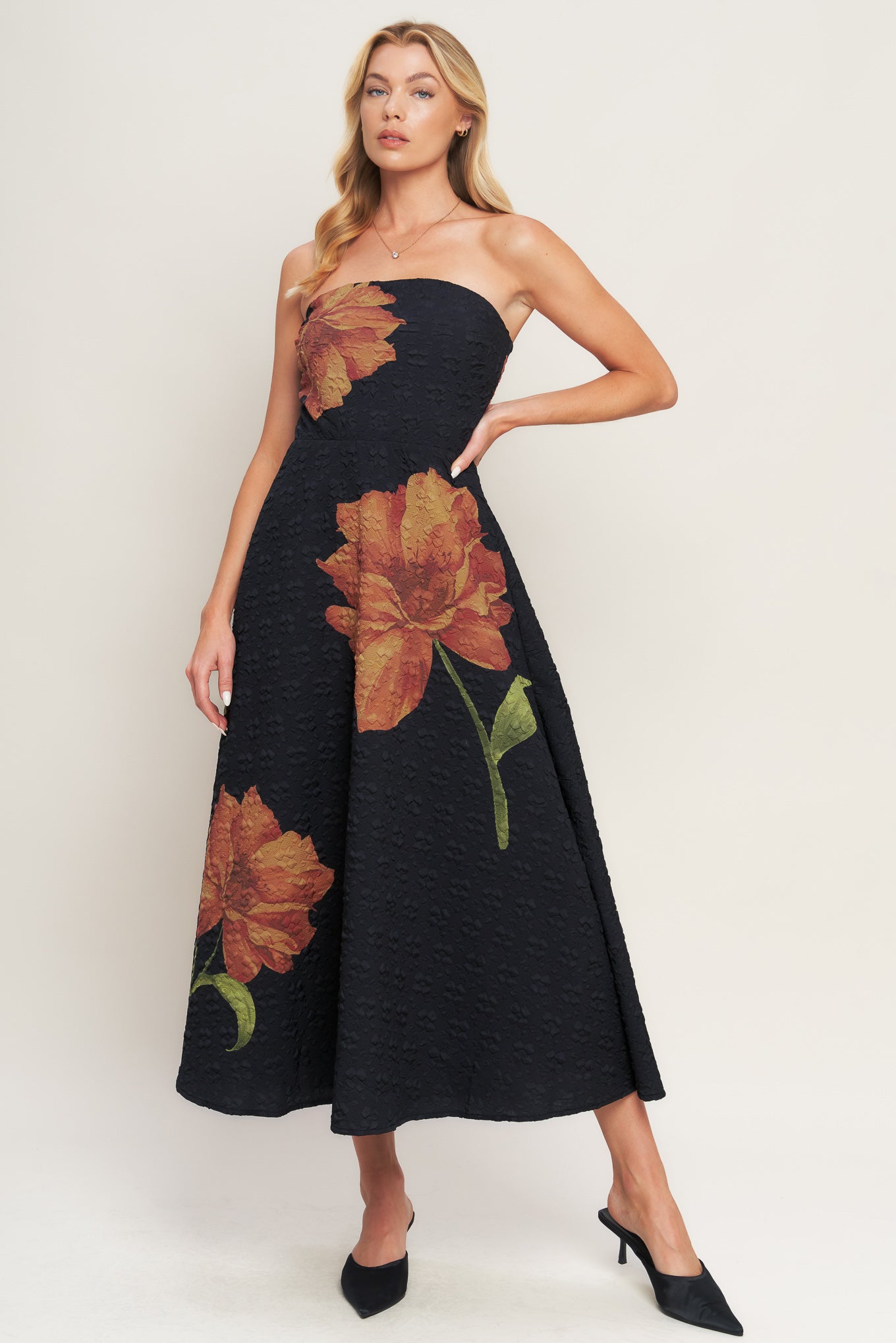 A printed textured woven midi dress featuring strapless, circle skirt and back zipper closure