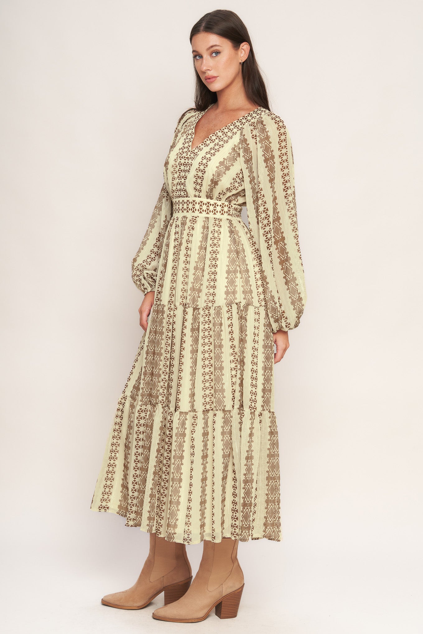 A printed metallic threaded woven midi dress featuring V neckline, long sleeve, tiered skirt and smocked back waist band
