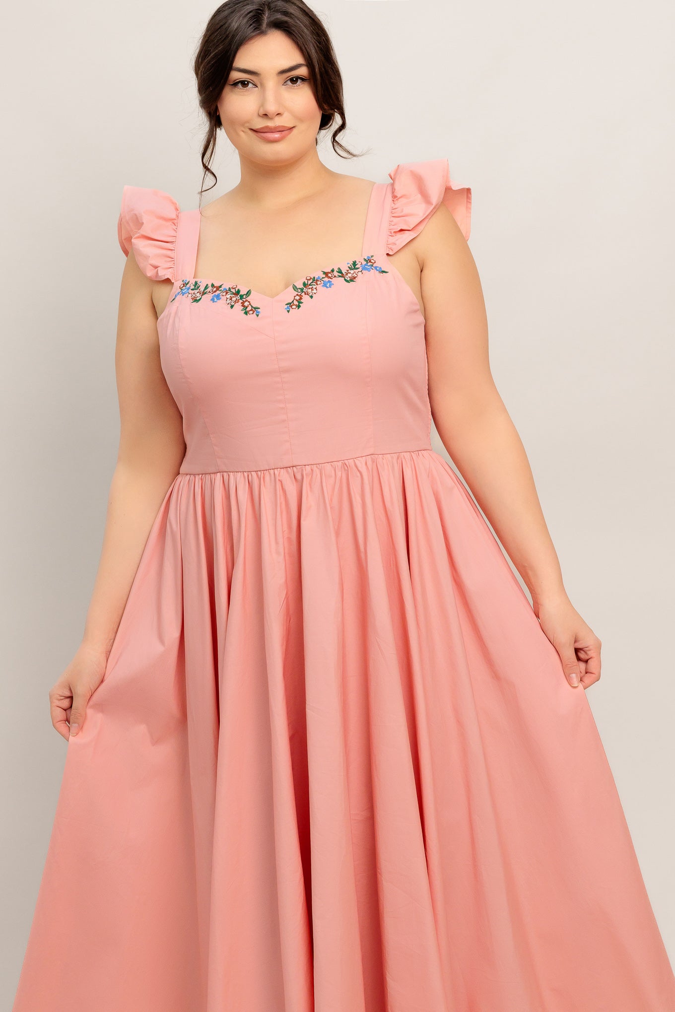 A solid woven midi dress featuring sweetheart neckline, short ruffle sleeve, embroidered front, basque waist, full skirt and smocked back bodice

Details:

Self: 100% Cotton

Lining: 100% Polyester

Size &amp; Fit

Model is 5`8" And Wearing Size Small&nbsp;
Measurements Taken From Size Small&nbsp;
Approx. Length: 49"