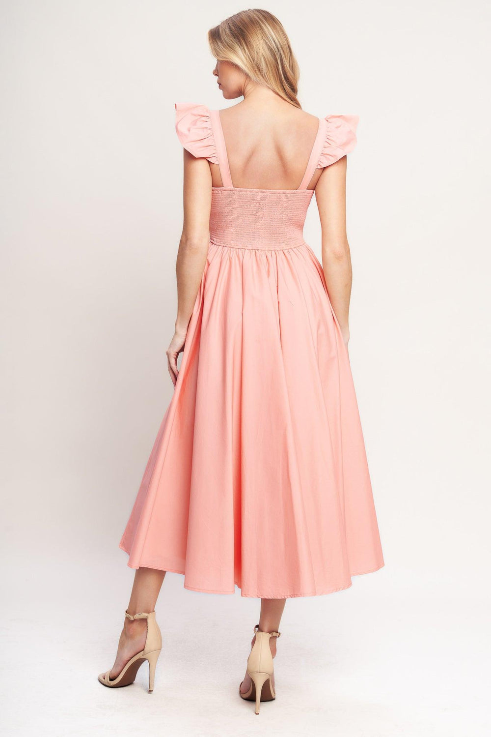 A solid woven midi dress featuring sweetheart neckline, short ruffle sleeve, embroidered front, basque waist, full skirt and smocked back bodice

Details:

Self: 100% Cotton

Lining: 100% Polyester

Size & Fit

-Model is 5`8" And Wearing Size Small
-Measurements Taken From Size Small
-Approx. Length: 49"