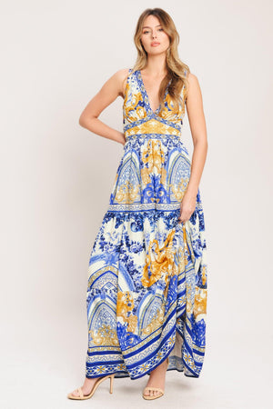 A printed woven maxi dress featuring V neckline, sleeveless, waist yoke, tiered skirt and smocked back waistband

Details:

Self: 100% Polyester

Lining: 100% Polyester

Size & Fit

-Model is 5`8" And Wearing Size Small
-Measurements Taken From Size Small
-Approx. Length: 61"
