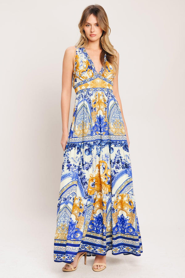 A printed woven maxi dress featuring V neckline, sleeveless, waist yoke, tiered skirt and smocked back waistband

Details:

Self: 100% Polyester

Lining: 100% Polyester

Size & Fit

-Model is 5`8" And Wearing Size Small
-Measurements Taken From Size Small
-Approx. Length: 61"