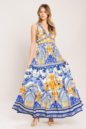 A printed woven maxi dress featuring V neckline, sleeveless, waist yoke, tiered skirt and smocked back waistband

Details:

Self: 100% Polyester

Lining: 100% Polyester

Size & Fit

-Model is 5`8" And Wearing Size Small
-Measurements Taken From Size Small
-Approx. Length: 61"