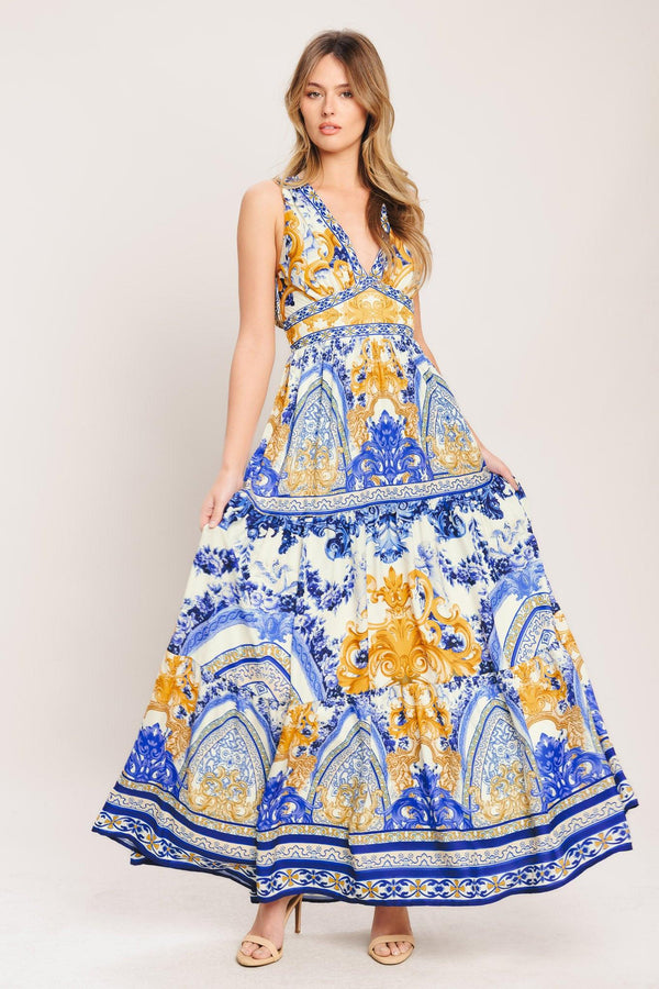 A printed woven maxi dress featuring V neckline, sleeveless, waist yoke, tiered skirt and smocked back waistband

Details:

Self: 100% Polyester

Lining: 100% Polyester

Size & Fit

-Model is 5`8" And Wearing Size Small
-Measurements Taken From Size Small
-Approx. Length: 61"