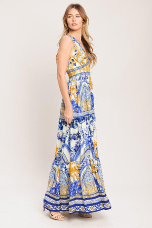 A printed woven maxi dress featuring V neckline, sleeveless, waist yoke, tiered skirt and smocked back waistband

Details:

Self: 100% Polyester

Lining: 100% Polyester

Size & Fit

-Model is 5`8" And Wearing Size Small
-Measurements Taken From Size Small
-Approx. Length: 61"