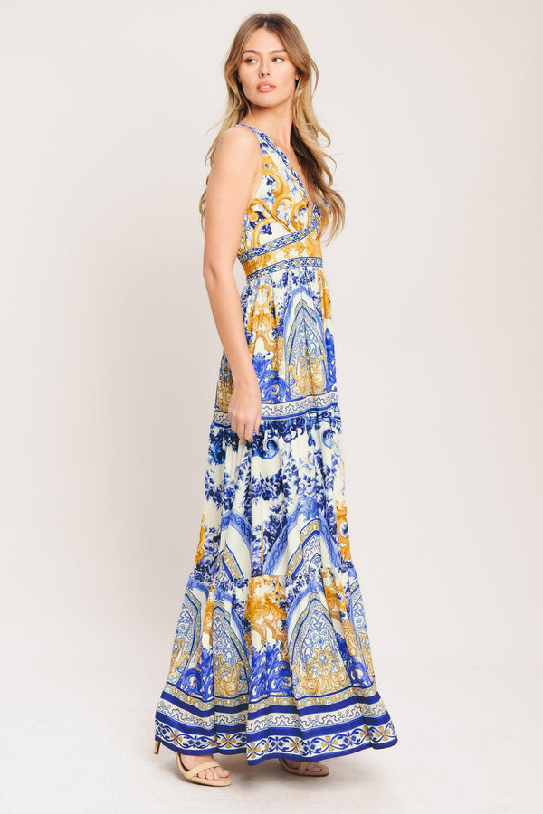 A printed woven maxi dress featuring V neckline, sleeveless, waist yoke, tiered skirt and smocked back waistband

Details:

Self: 100% Polyester

Lining: 100% Polyester

Size & Fit

-Model is 5`8" And Wearing Size Small
-Measurements Taken From Size Small
-Approx. Length: 61"