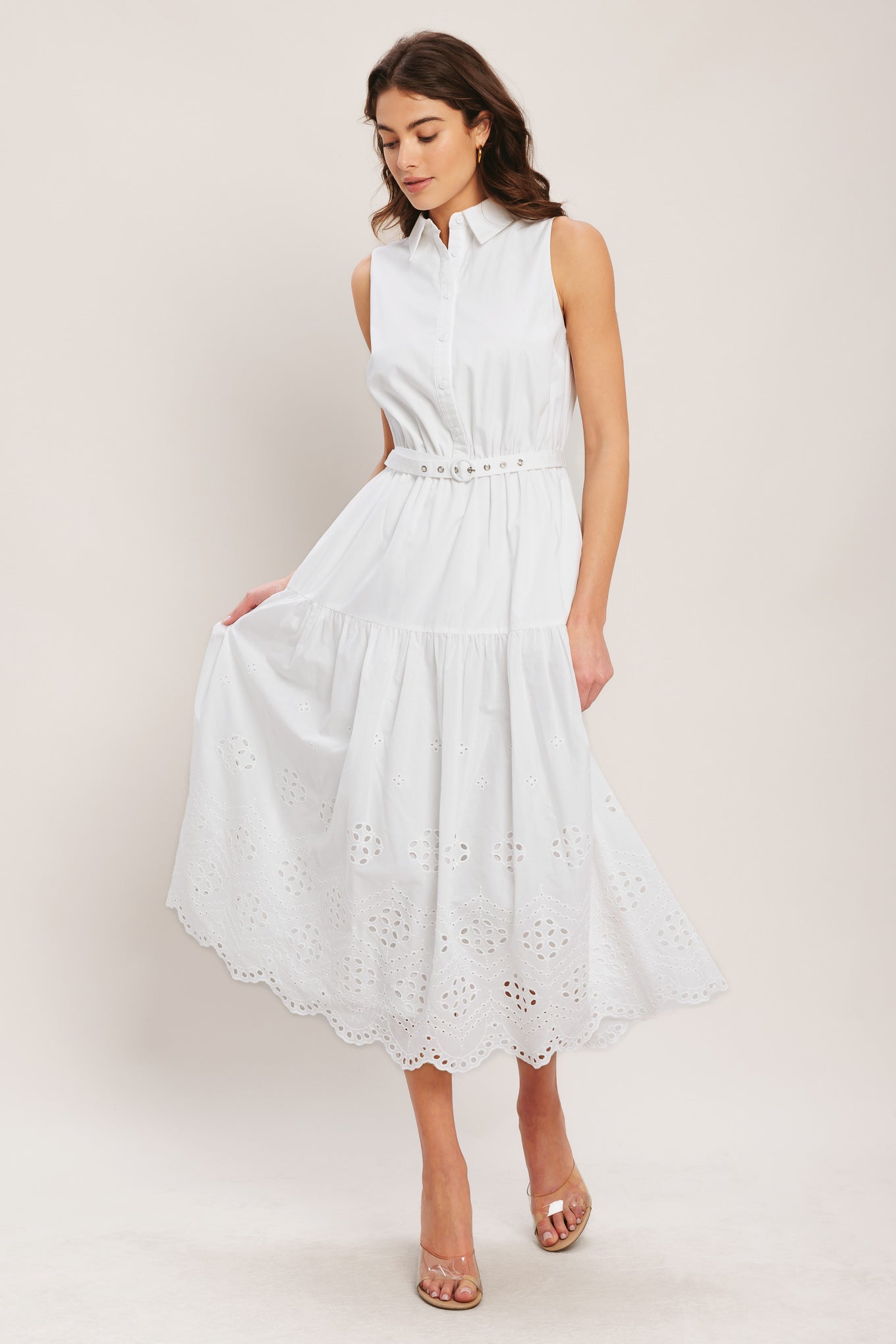 
A solid woven midi dress featuring collar, button down bodice, sleeveless, self belt and eyelet hem

Details:

Self : 100% Cotton
Contrast : 100% Cotton
Lining : 100% Polyester

Size &amp; Fit

- Model is 5`8" And Wearing Size Small
- Measurements Taken From Size Small
- Approx. Length: 51"