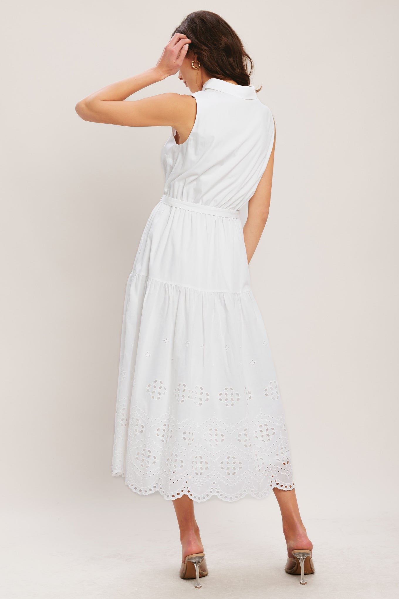 
A solid woven midi dress featuring collar, button down bodice, sleeveless, self belt and eyelet hem

Details:

Self : 100% Cotton
Contrast : 100% Cotton
Lining : 100% Polyester

Size &amp; Fit

- Model is 5`8" And Wearing Size Small
- Measurements Taken From Size Small
- Approx. Length: 51"