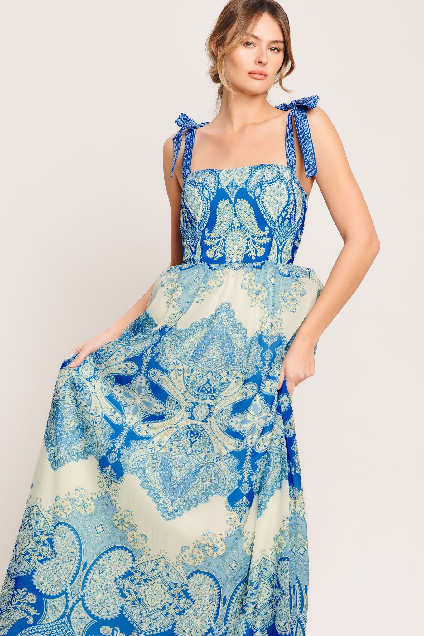 A printed woven maxi dress featuring straight neckline, shoulder ties, full skirt and smocked back bodice

Details:

Self: 100% Polyester

Lining: 100% Polyester

Size & Fit

-Model is 5`8" And Wearing Size Small
-Measurements Taken From Size Small
-Approx. Length: 60"