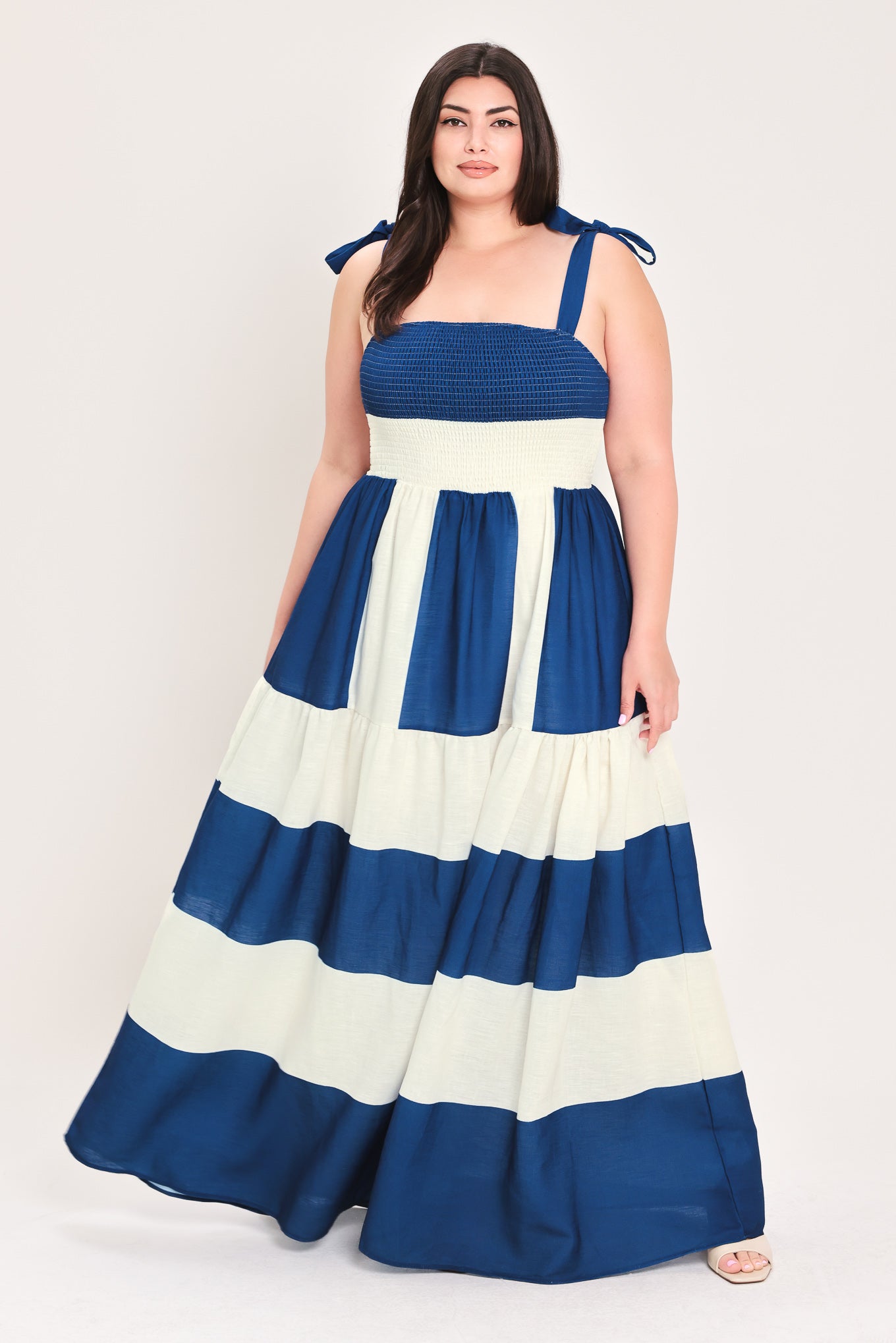 Woman wearing a blue and white dress with bow straps | Flying Tomato Curve