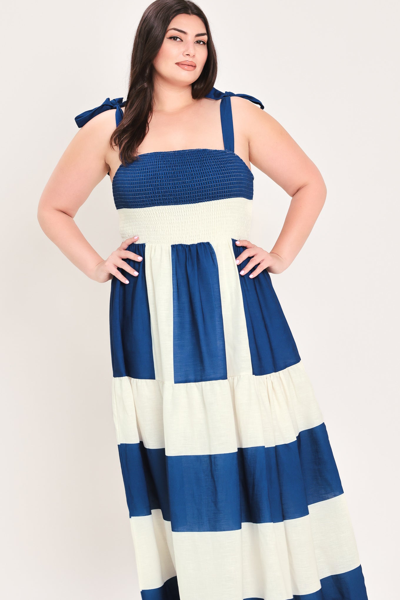 Woman wearing a blue and white dress with bow straps | Flying Tomato Curve