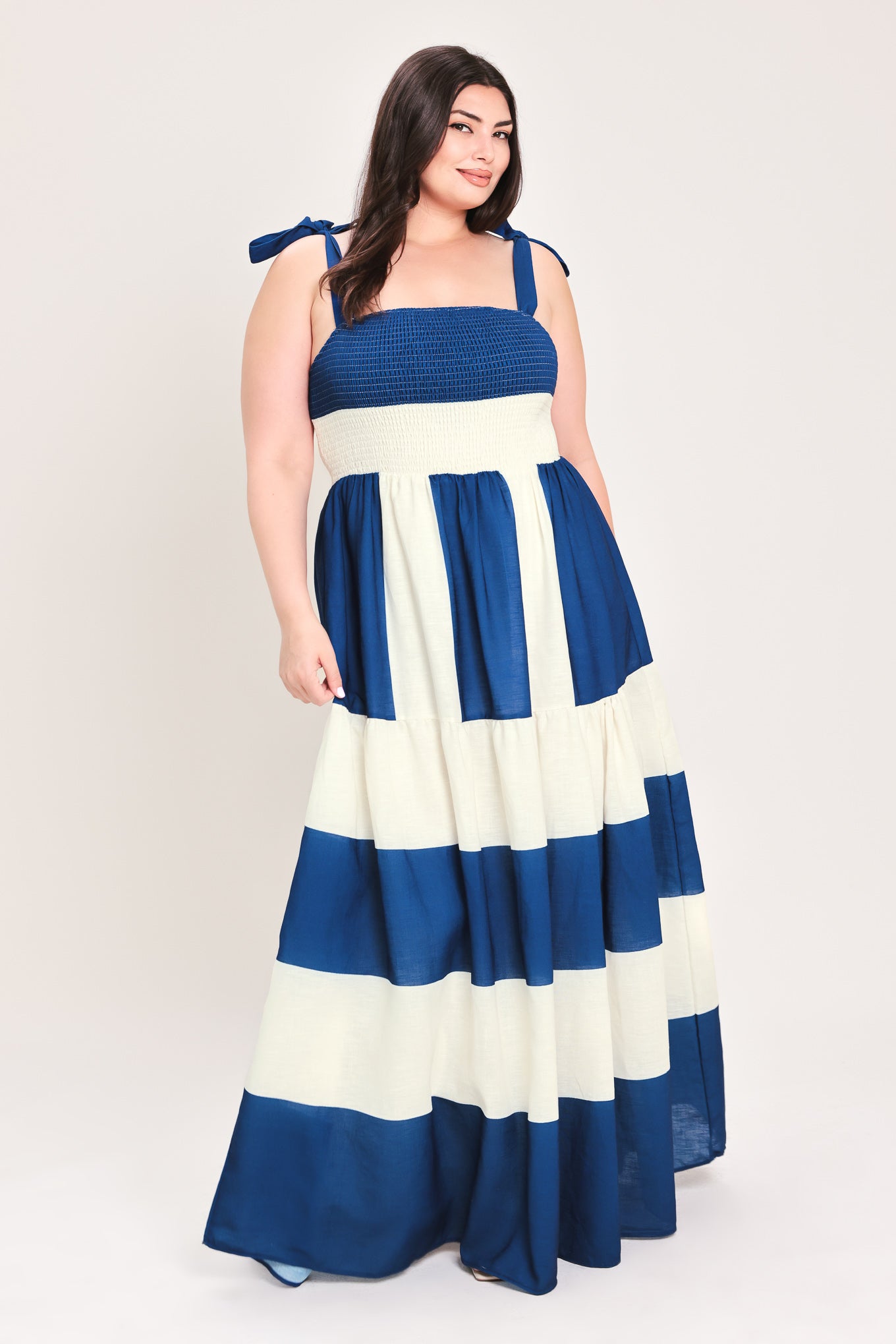 Woman wearing a blue and white dress with bow straps | Flying Tomato Curve