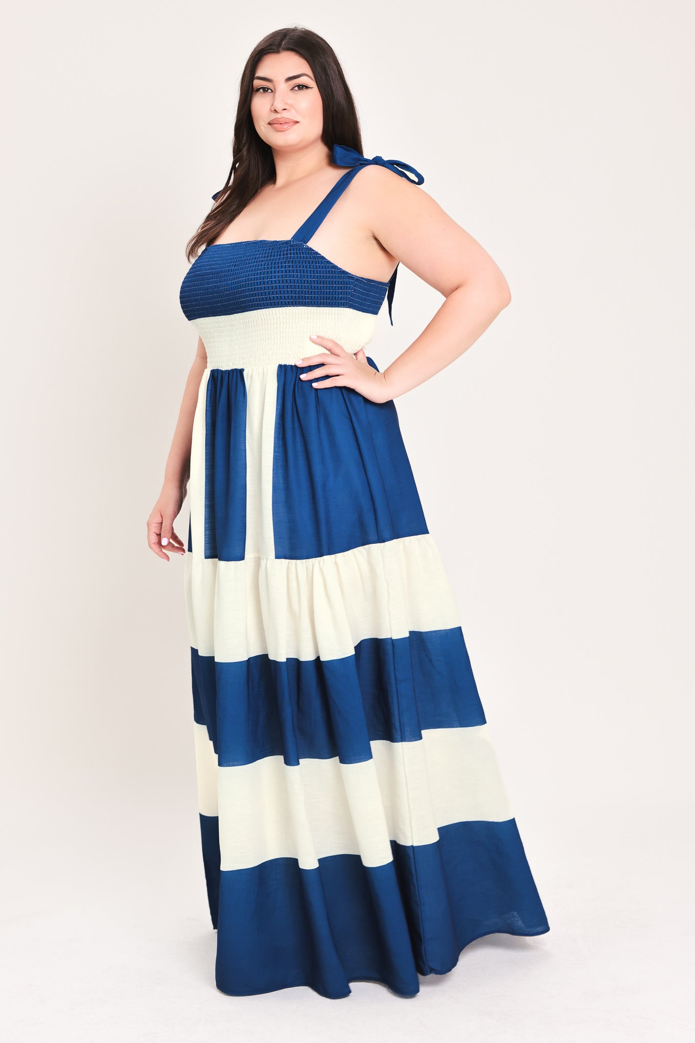 Woman wearing a blue and white dress with bow straps | Flying Tomato Curve