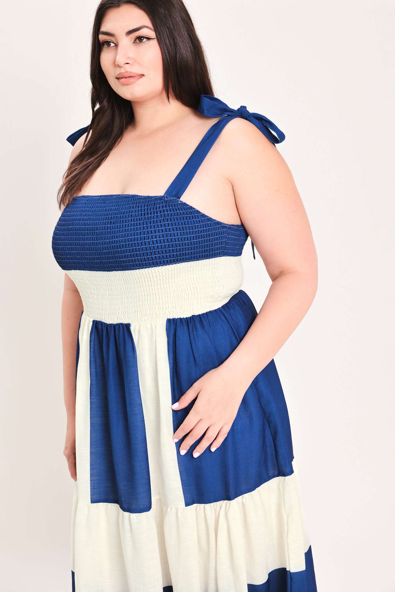 Woman wearing a blue and white dress with bow straps | Flying Tomato Curve