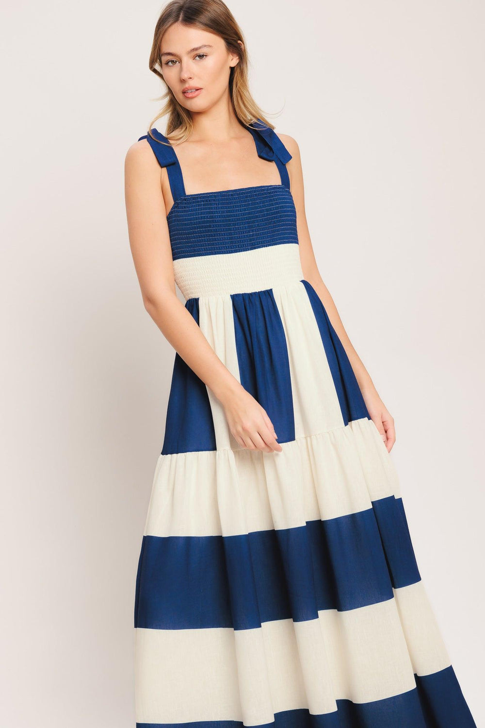 A printed woven maxi dress featuring straight neckline, shoulder ties, smocked bodice and tiered skirt

Details:

Self: 100% Polyester

Lining: 100% Polyester

Size & Fit

-Model is 5`8" And Wearing Size Small
-Measurements Taken From Size Small
-Approx. Length: 59"