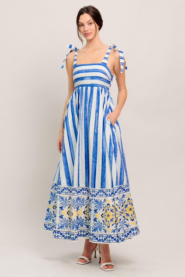
A printed woven midi dress featuring straight neckline, shoulder tie and smocked back bodice

Details:

Self : 100% Cotton
Lining : 100% Polyester

Size &amp; Fit

- Model is 5`8" And Wearing Size Small
- Measurements Taken From Size Small
- Approx. Length: 52" Flying Tomato