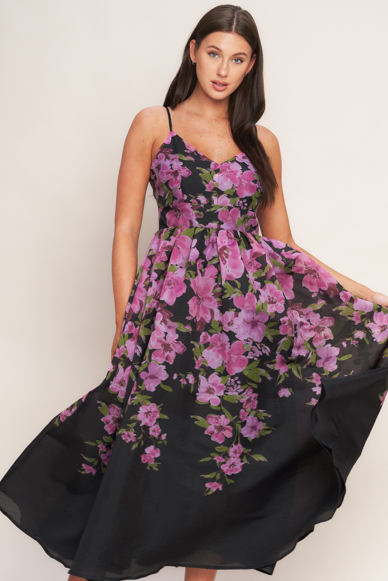 A printed woven midi dress featuring cami top, wide waist band, full skirt and back zipper closure