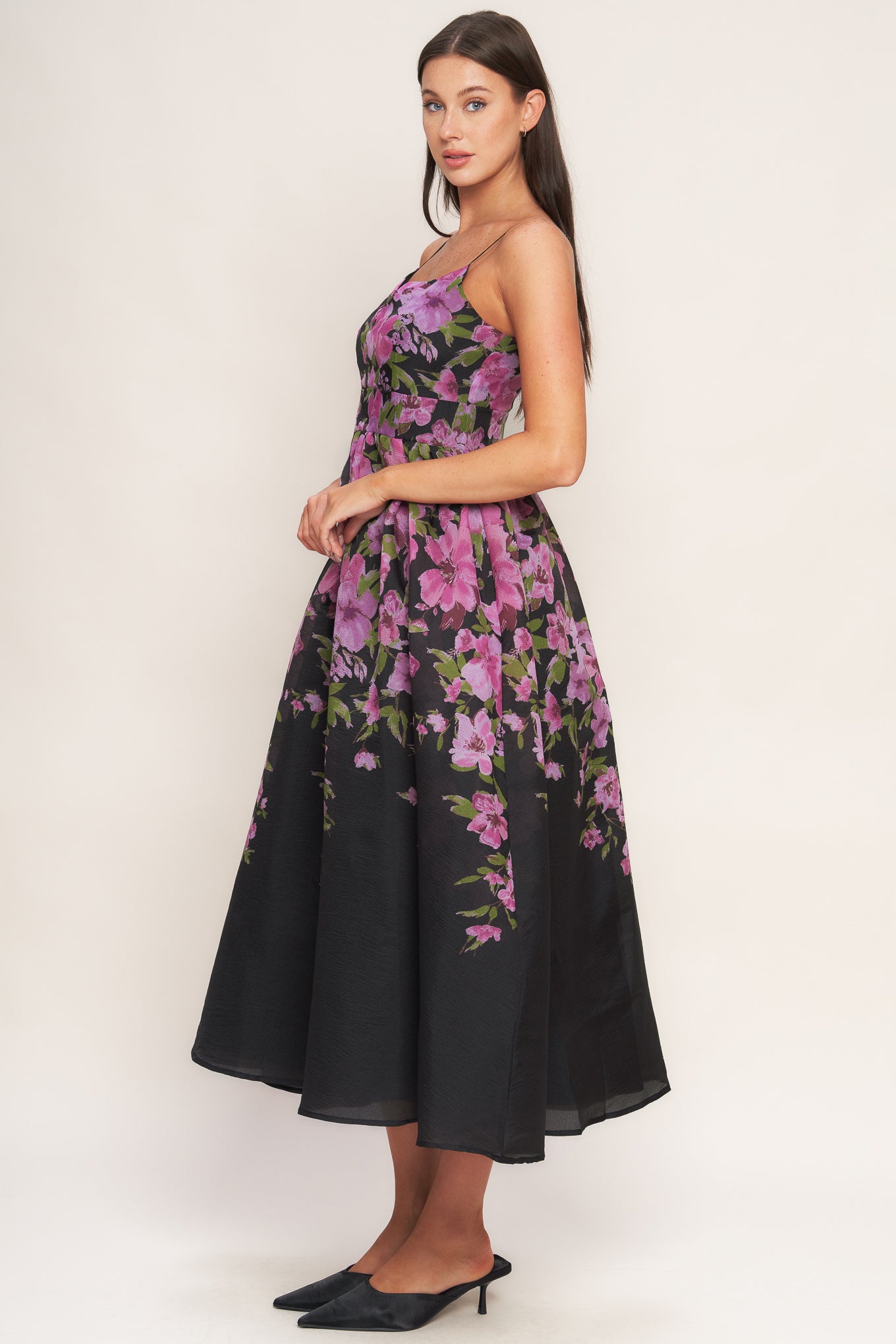 A printed woven midi dress featuring cami top, wide waist band, full skirt and back zipper closure