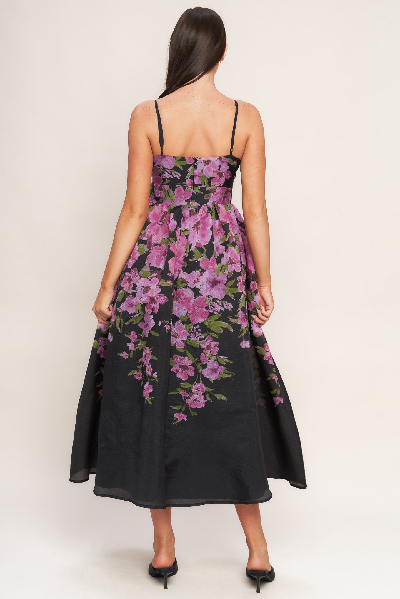 A printed woven midi dress featuring cami top, wide waist band, full skirt and back zipper closure