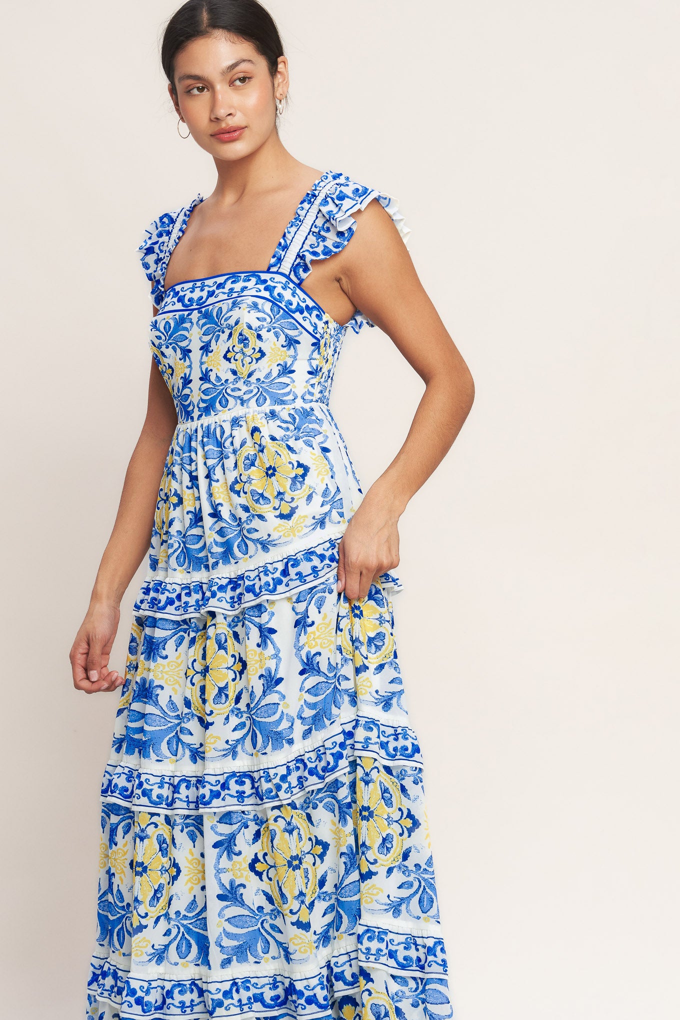 
A printed woven maxi dress featuring straight neckline, ruffle sleeve, tiered skirt with ruffle inset and smocked back bodice

Details:

Self : 100% Polyester
Lining : 100% Polyester

Size &amp; Fit

- Model is 5`8" And Wearing Size Small
- Measurements Taken From Size Small
- Approx. Length: 59" Flying Tomato