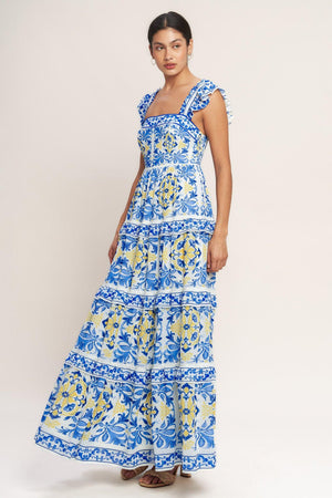 
A printed woven maxi dress featuring straight neckline, ruffle sleeve, tiered skirt with ruffle inset and smocked back bodice

Details:

Self : 100% Polyester
Lining : 100% Polyester

Size &amp; Fit

- Model is 5`8" And Wearing Size Small
- Measurements Taken From Size Small
- Approx. Length: 59" Flying Tomato