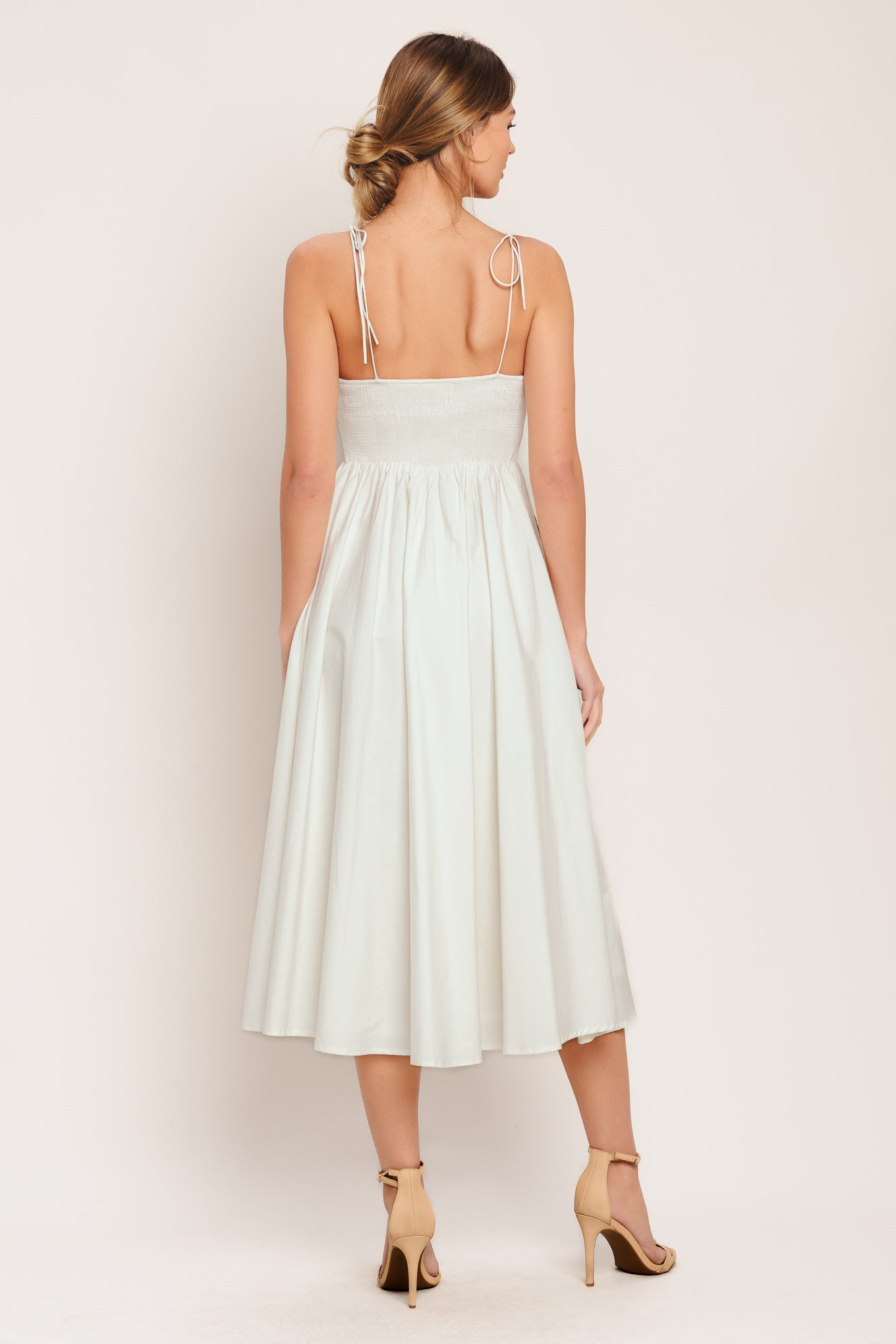 A printed woven midi dress featuring cami top, shoulder ties, waist yoke, full skirt and smocked back bodice

Details:

Self: 100% Cotton

Lining : 100% Polyester

Size & Fit

-Model is 5`8" And Wearing Size Small
-Measurements Taken From Size Small
-Approx. Length: 48"