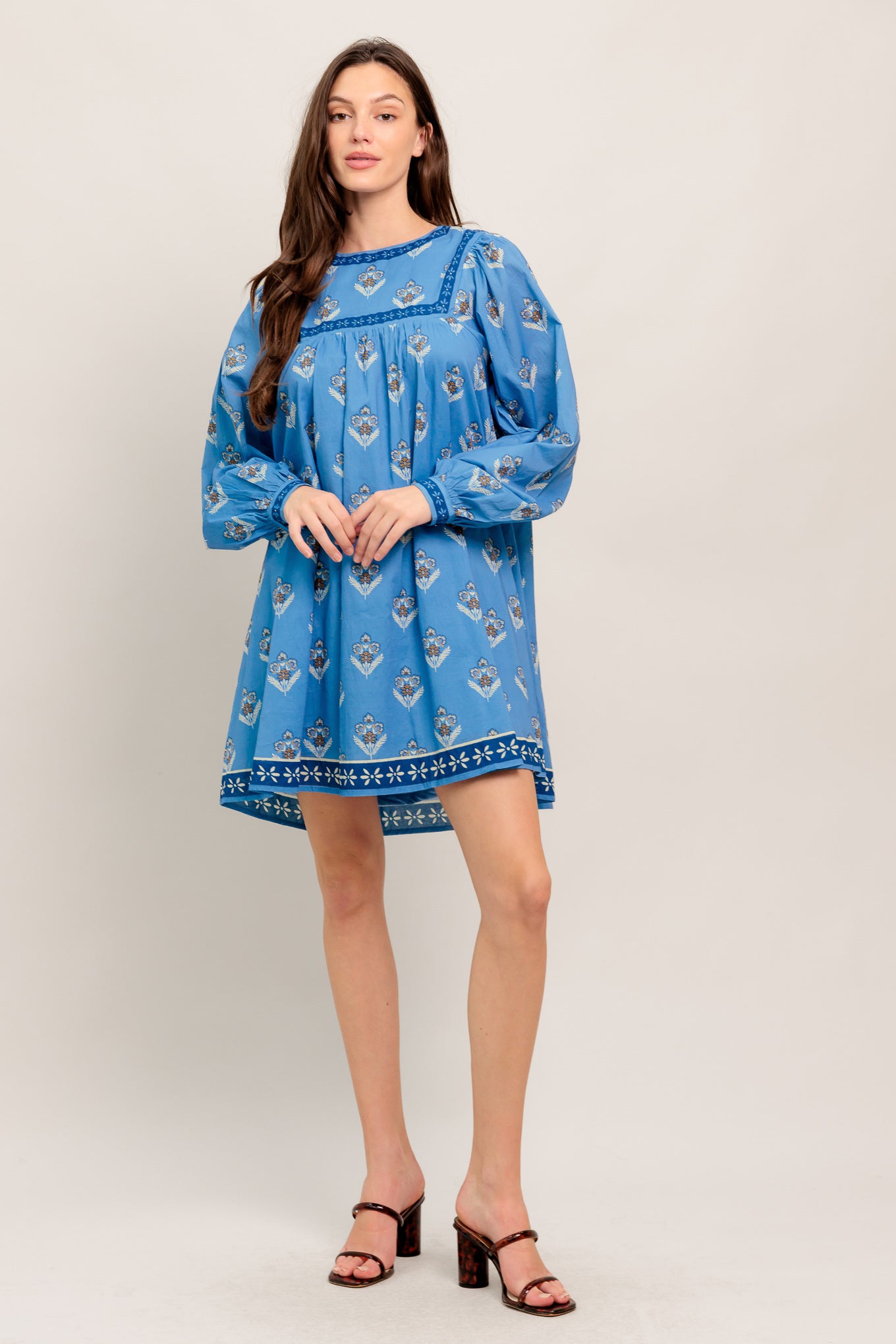 Blue long-sleeve dress with floral print and border trim

Details:

Self: 100% Cotton
Lining: 100% Polyester

Size & Fit

- Model is 5`8" And Wearing Size Small
- Measurements Taken From Size Small
- Approx. Length: 34"