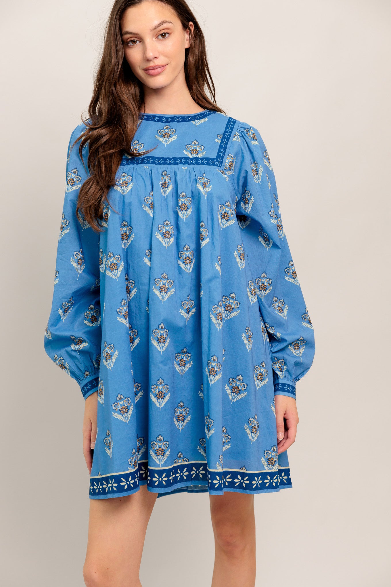 Blue long-sleeve dress with floral print and border trim

Details:

Self: 100% Cotton
Lining: 100% Polyester

Size & Fit

- Model is 5`8" And Wearing Size Small
- Measurements Taken From Size Small
- Approx. Length: 34"