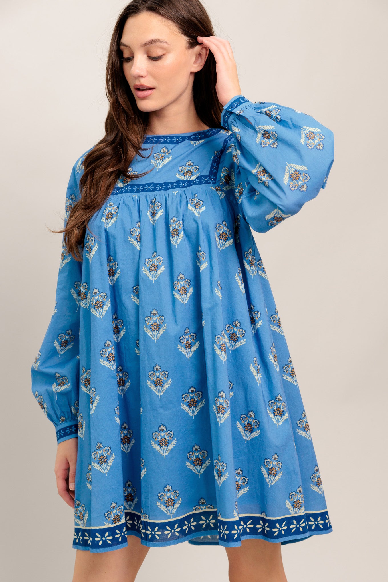 Blue long-sleeve dress with floral print and border trim

Details:

Self: 100% Cotton
Lining: 100% Polyester

Size & Fit

- Model is 5`8" And Wearing Size Small
- Measurements Taken From Size Small
- Approx. Length: 34"
