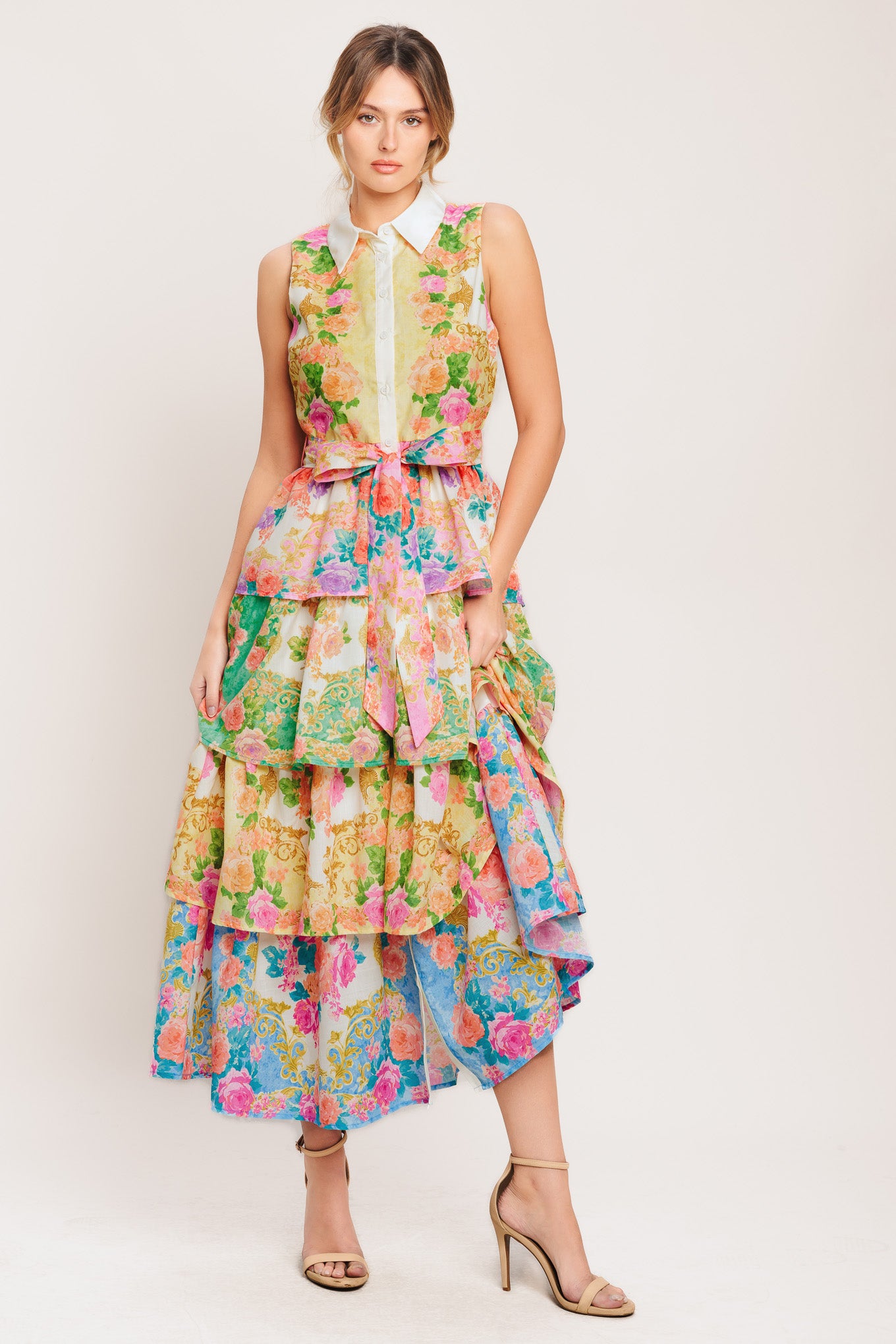 A printed woven midi dress featuring collar, sleeveless, front button down, self sash tie and layered skirt

Details:

Self: 100% Polyester

Lining : 100% Polyester

Size & Fit

-Model is 5`8" And Wearing Size Small
-Measurements Taken From Size Small
-Approx. Length: 55"
