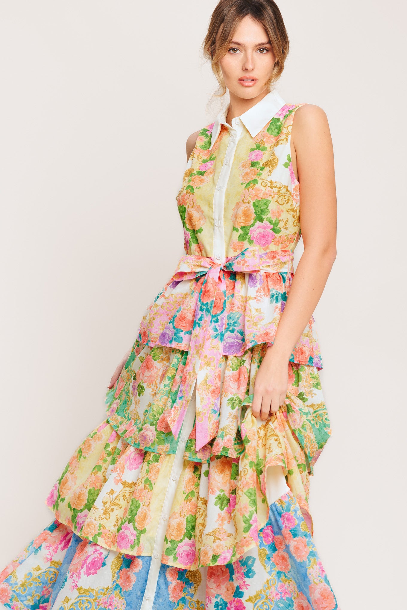 A printed woven midi dress featuring collar, sleeveless, front button down, self sash tie and layered skirt

Details:

Self: 100% Polyester

Lining : 100% Polyester

Size & Fit

-Model is 5`8" And Wearing Size Small
-Measurements Taken From Size Small
-Approx. Length: 55"