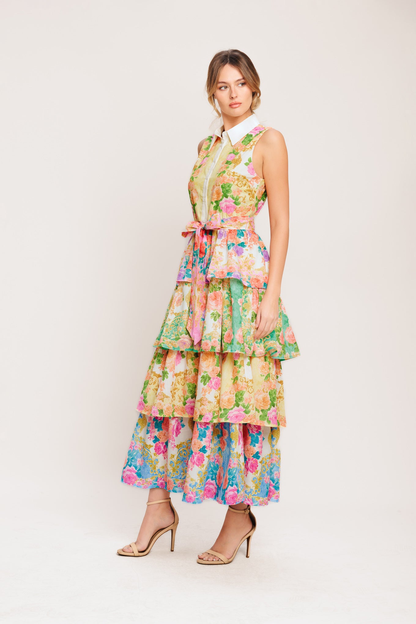 A printed woven midi dress featuring collar, sleeveless, front button down, self sash tie and layered skirt

Details:

Self: 100% Polyester

Lining : 100% Polyester

Size & Fit

-Model is 5`8" And Wearing Size Small
-Measurements Taken From Size Small
-Approx. Length: 55"