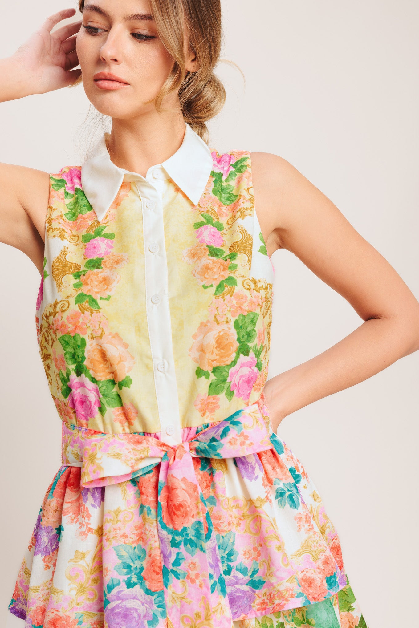 A printed woven midi dress featuring collar, sleeveless, front button down, self sash tie and layered skirt

Details:

Self: 100% Polyester

Lining : 100% Polyester

Size & Fit

-Model is 5`8" And Wearing Size Small
-Measurements Taken From Size Small
-Approx. Length: 55"