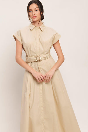 A solid woven midi dress featuring collar, cuffed short sleeve, hidden button down, self belt and full skirt

Details:

Self: 100% Cotton

Size & Fit

-Model is 5`8" And Wearing Size Small
-Measurements Taken From Size Small
-Approx. Length: 52"