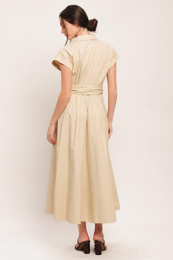A solid woven midi dress featuring collar, cuffed short sleeve, hidden button down, self belt and full skirt

Details:

Self: 100% Cotton

Size & Fit

-Model is 5`8" And Wearing Size Small
-Measurements Taken From Size Small
-Approx. Length: 52"