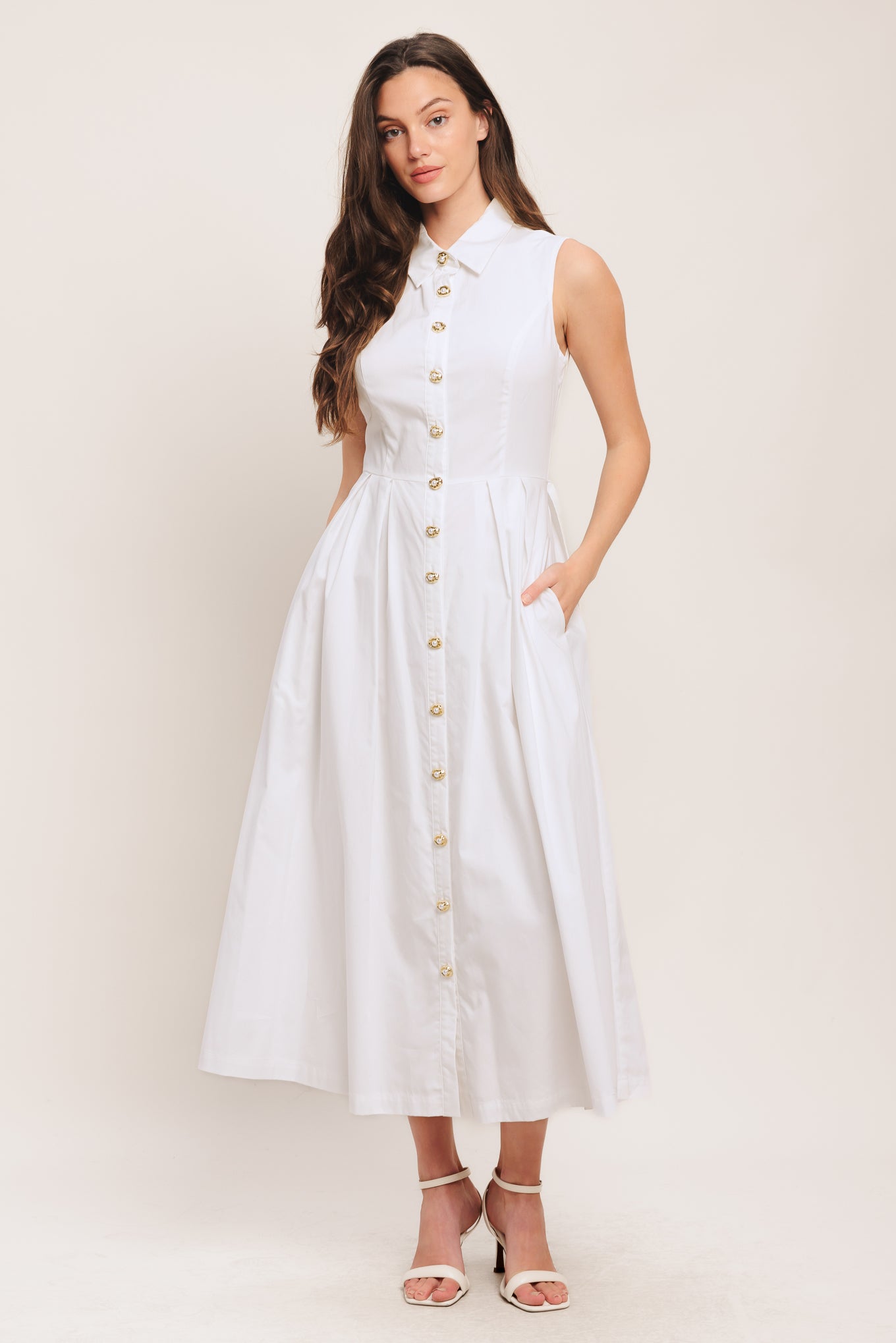 A solid woven midi dress featuring collar, sleeveless, jewel button down, self belt, side pocket and full skirt

Details:

Self: 100% Cotton

Lining: 100% Polyester

Size & Fit

-Model is 5`8" And Wearing Size Small
-Measurements Taken From Size Small
-Approx. Length: 50"