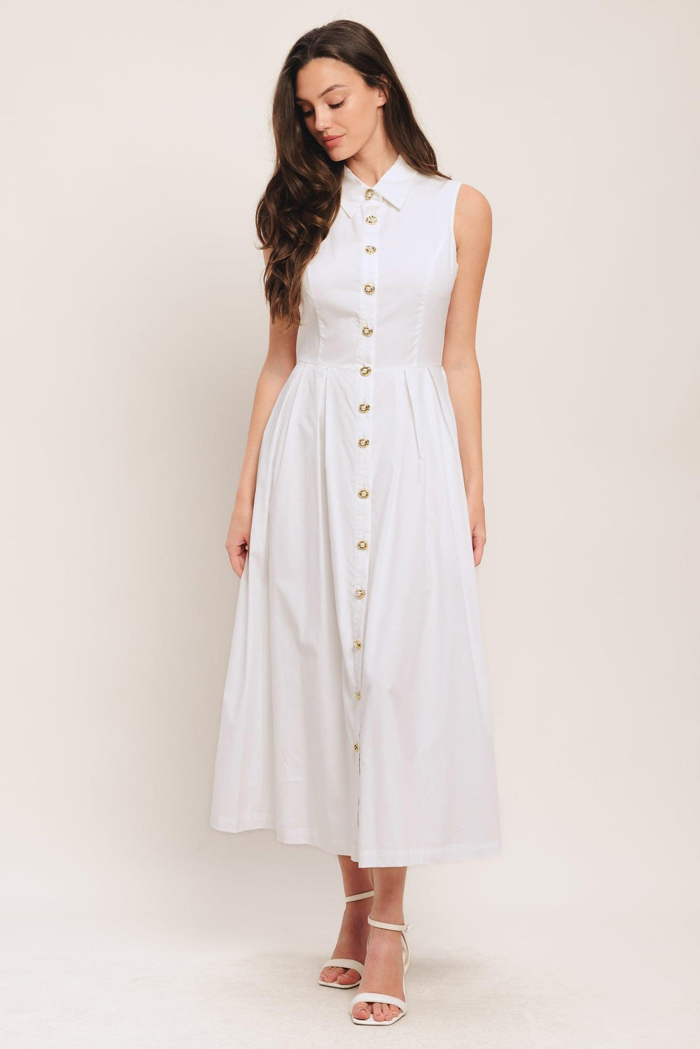 A solid woven midi dress featuring collar, sleeveless, jewel button down, self belt, side pocket and full skirt

Details:

Self: 100% Cotton

Lining: 100% Polyester

Size & Fit

-Model is 5`8" And Wearing Size Small
-Measurements Taken From Size Small
-Approx. Length: 50"