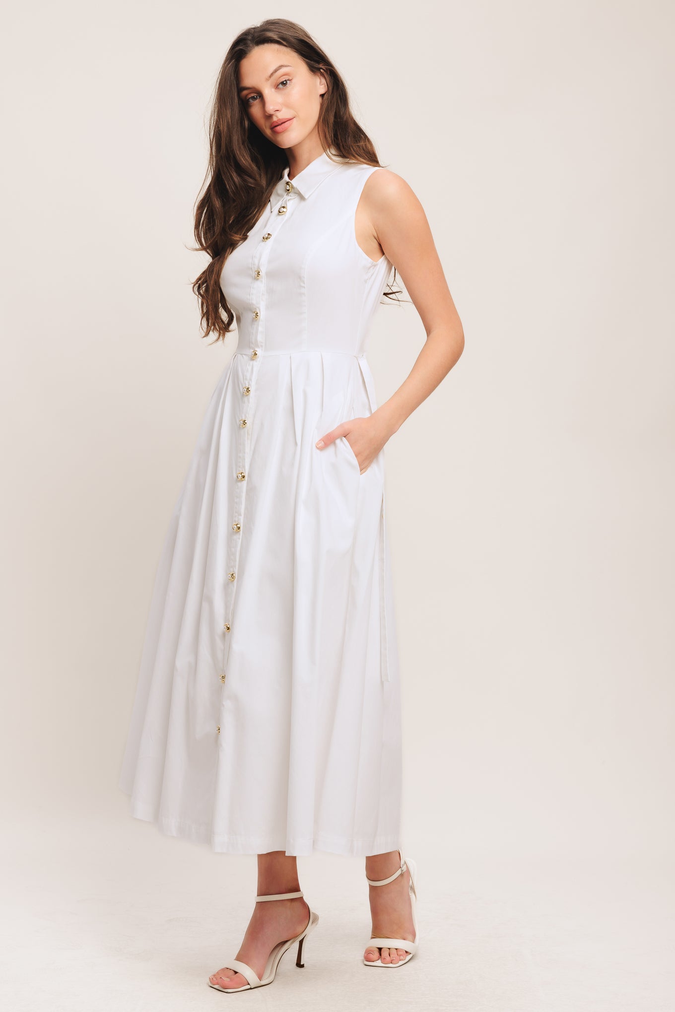 A solid woven midi dress featuring collar, sleeveless, jewel button down, self belt, side pocket and full skirt

Details:

Self: 100% Cotton

Lining: 100% Polyester

Size & Fit

-Model is 5`8" And Wearing Size Small
-Measurements Taken From Size Small
-Approx. Length: 50"