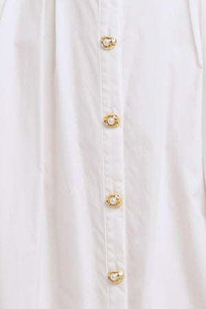 A solid woven midi dress featuring collar, sleeveless, jewel button down, self belt, side pocket and full skirt

Details:

Self: 100% Cotton

Lining: 100% Polyester

Size & Fit

-Model is 5`8" And Wearing Size Small
-Measurements Taken From Size Small
-Approx. Length: 50"