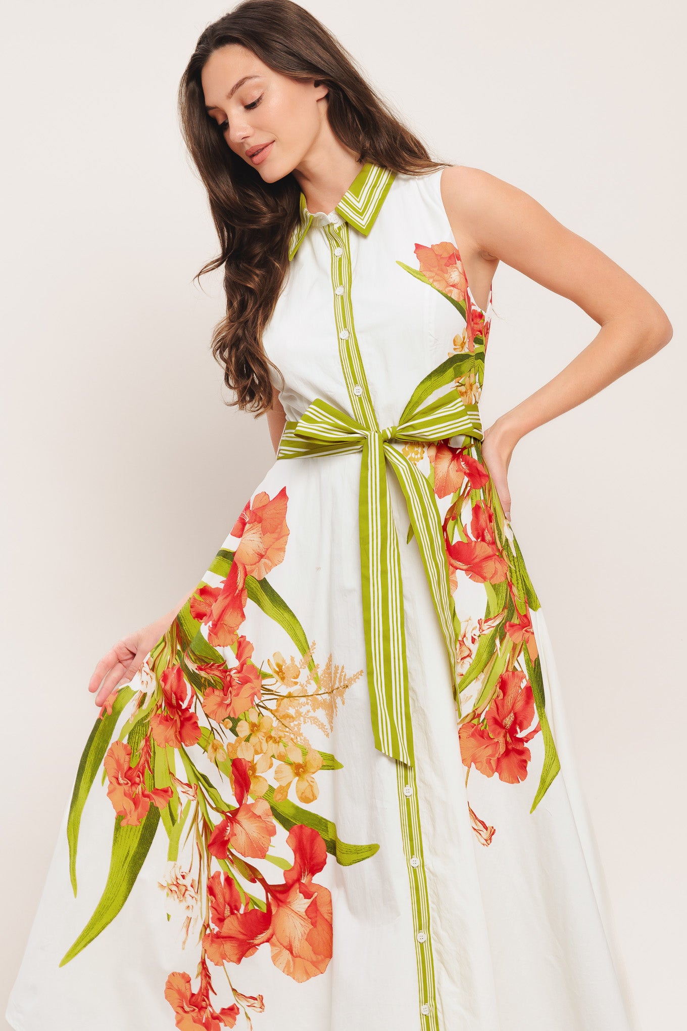 A printed woven midi dress featuring collar, sleeveless, front button down, self sash tie and circle skirt

Details:

Self: 100% Cotton

Lining: 100% Polyester

Size & Fit

-Model is 5`8" And Wearing Size Small
-Measurements Taken From Size Small
-Approx. Length: 50"