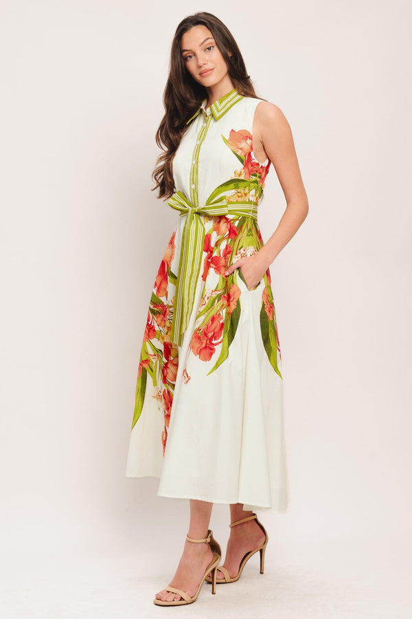 A printed woven midi dress featuring collar, sleeveless, front button down, self sash tie and circle skirt

Details:

Self: 100% Cotton

Lining: 100% Polyester

Size & Fit

-Model is 5`8" And Wearing Size Small
-Measurements Taken From Size Small
-Approx. Length: 50"
