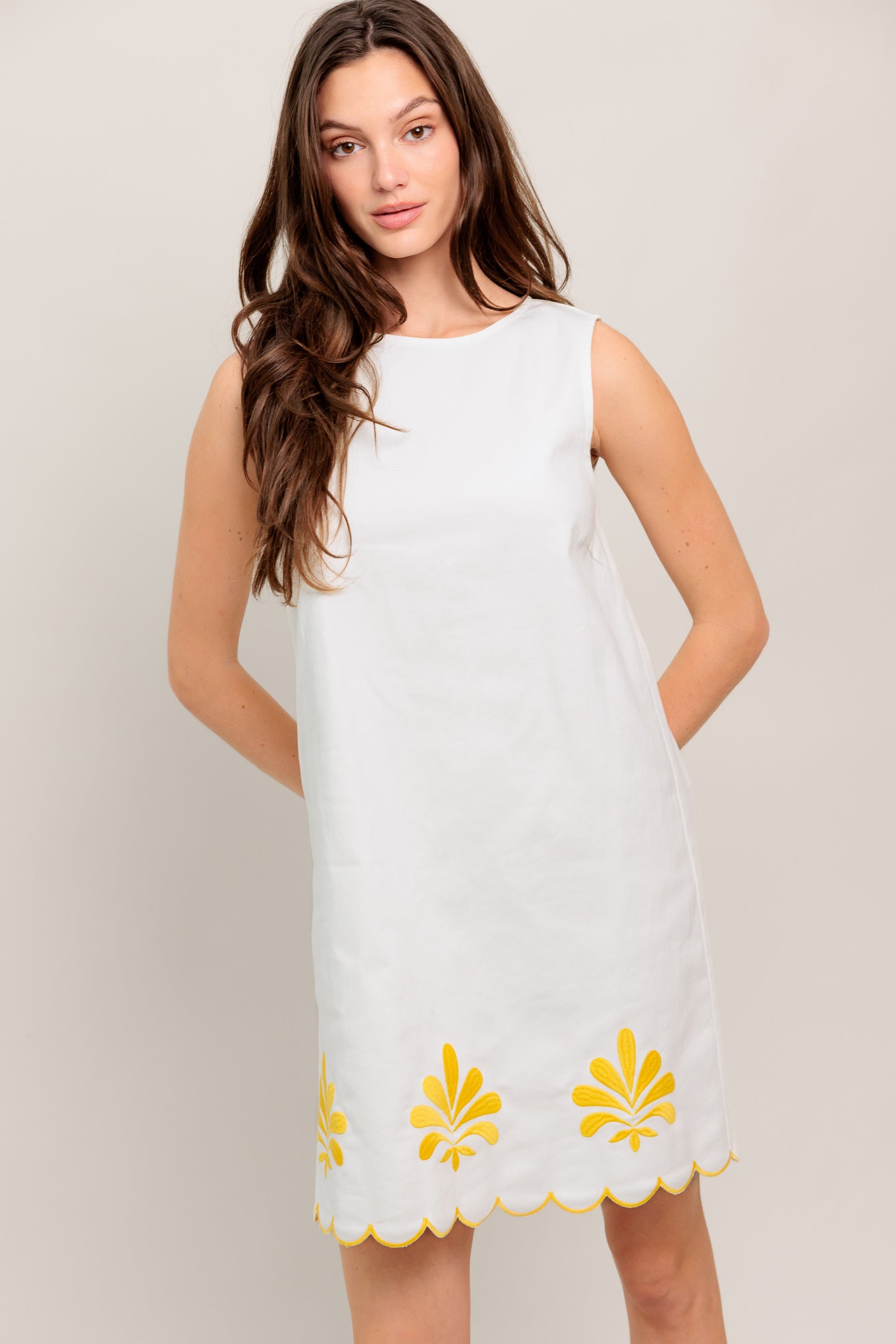 
A solid woven mini dress featuring round neckline, sleeveless, embroidered scallop hem and back zipper closure

Details:

Self : 97% Cotton 3% Spandex

Size &amp; Fit

- Model is 5`8" And Wearing Size Small
- Measurements Taken From Size Small
- Approx. Length: 35" Flying Tomato