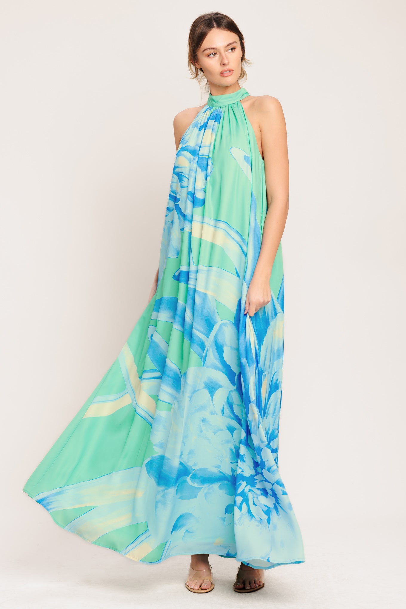 A printed woven maxi dress featuring halter neckline, contrasting belt and back button closure

Details:

Self: 100% Polyester

Lining: 100% Polyester

Size & Fit

-Model is 5`8" And Wearing Size Small
-Measurements Taken From Size Small
-Approx. Length: 61"
